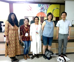 With her co - panelists at the APWT conference, Bali